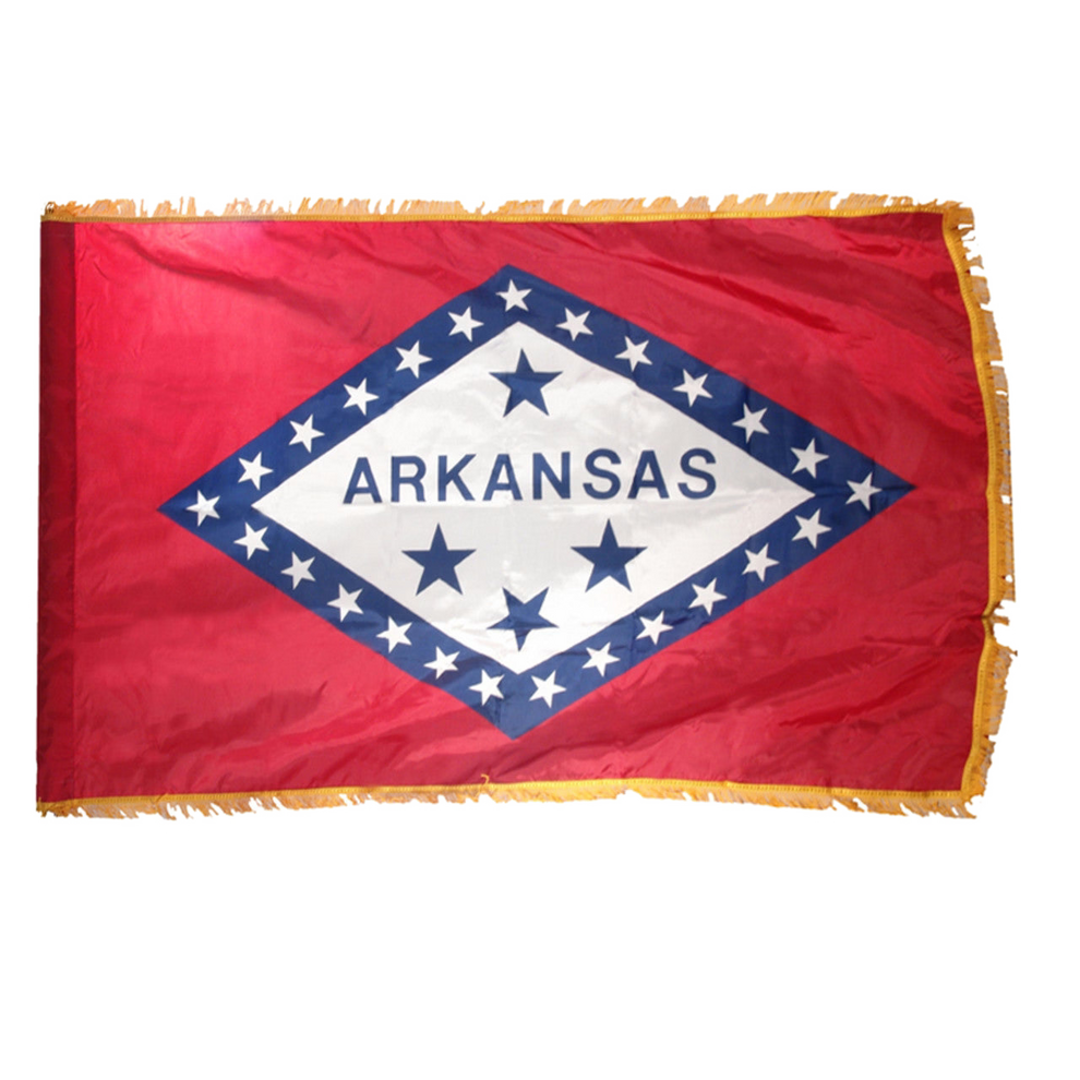 State of Arkansas flag with red background and a large horizontal diamonded outlined in blue with white stars and a white center with four blue stars and "Arkansas" text.  This flag has fringe.