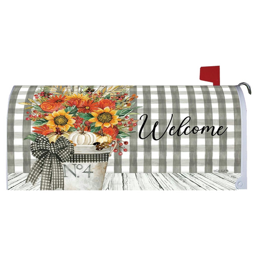 Mailbox cover with autumn design, flowers, pumpkins, and 'Welcome' text on a checkered background.