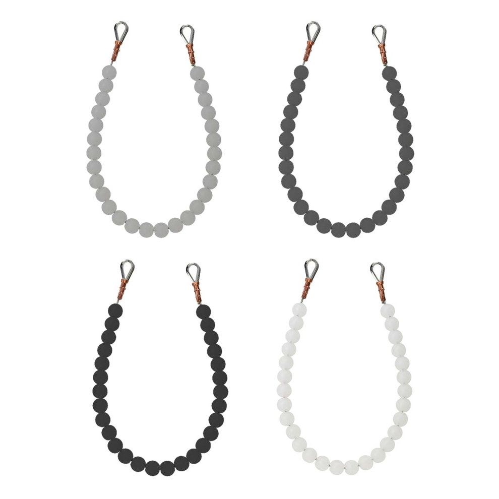 Four beaded retainer rings of different colors on a white background