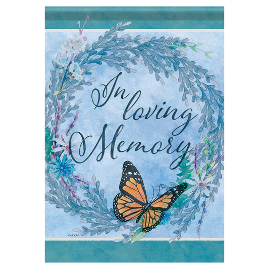 Memorial banner with 'In loving memory' text, butterfly, and floral wreath on a blue background.