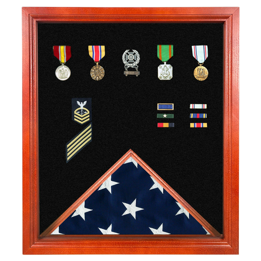 Framed military shadow box displaying medals, ribbons, rank insignia, and a folded American flag.