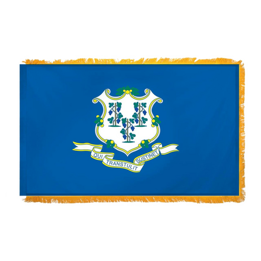 Connecticut state flag with a white shield, grapevines, and motto on a blue field with gold fringe.