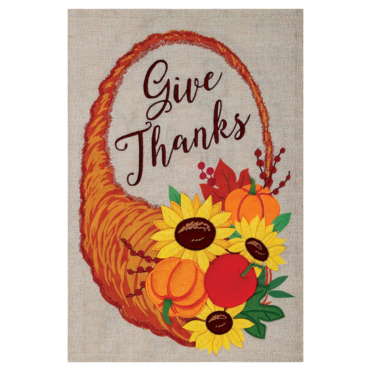 Decorative garden flag with 'Give Thanks' text, cornucopia, pumpkins, and sunflowers on a beige background.