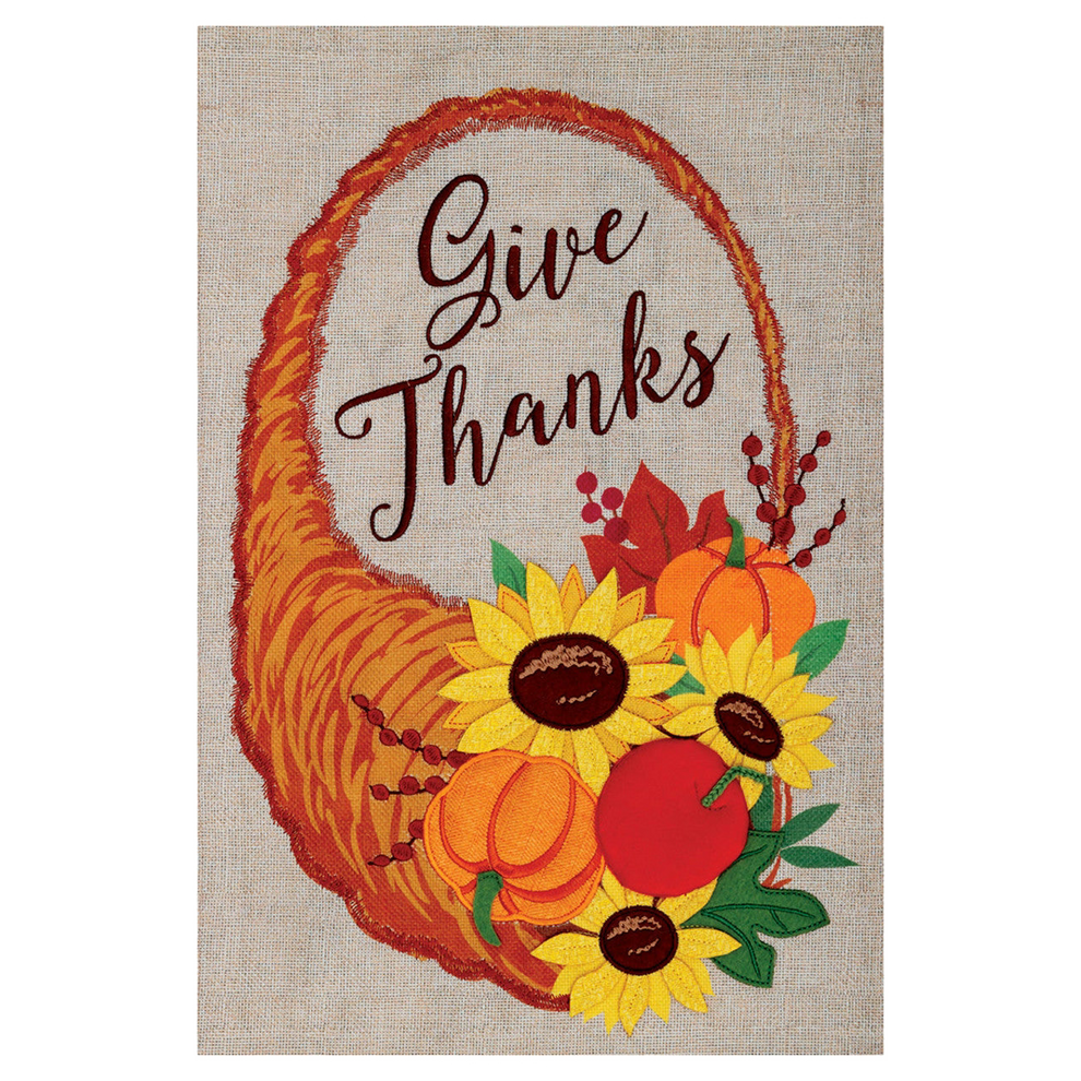Decorative garden flag with 'Give Thanks' text, cornucopia, pumpkins, and sunflowers on a beige background.