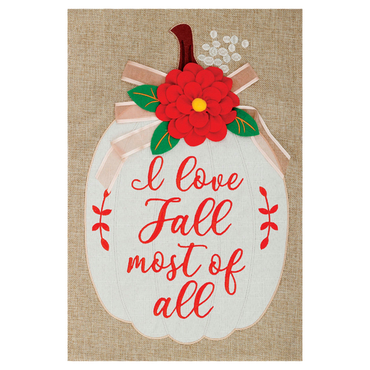 Decorative garden flag with pumpkin and red flower on a burlap background, featuring the text 'I love Fall most of all'.