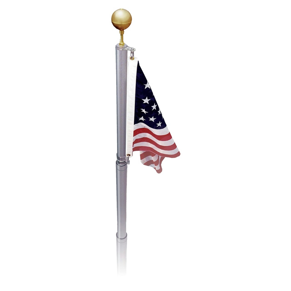A telescoping aluminum flagpole with a United States flag flying on it. The flagpole is extended and the flag is displayed showing red and white stripes and white stars on a blue background.