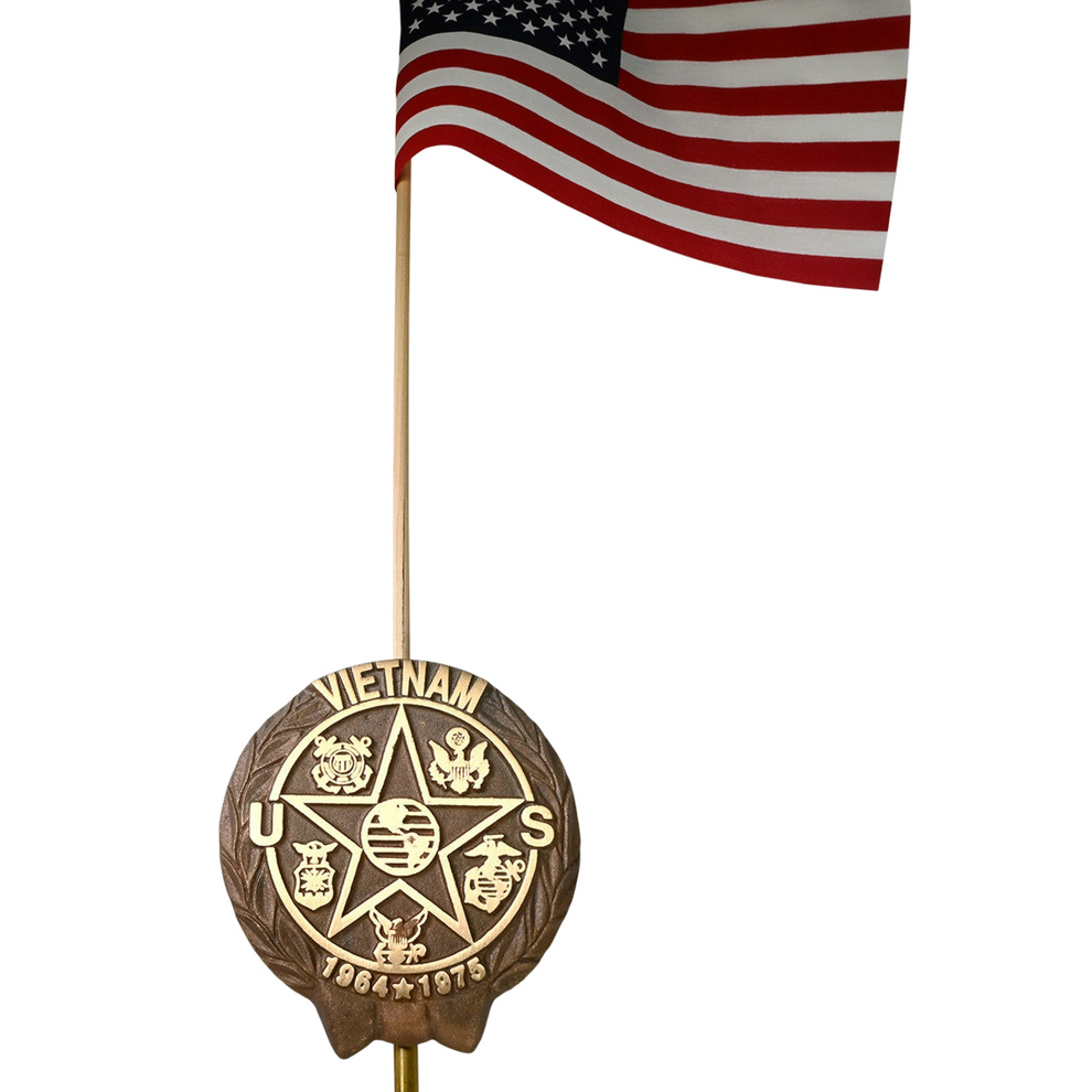 Vietnam war grave marker on an American stick flag