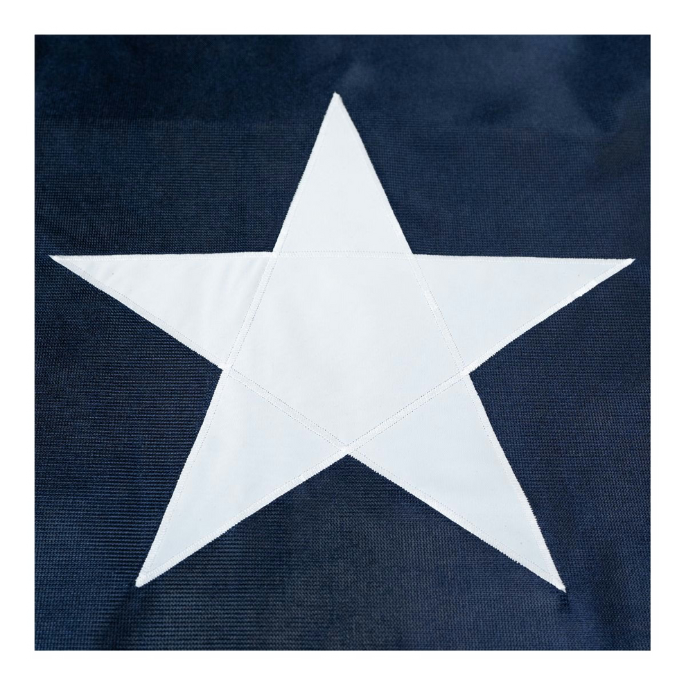Close up of a Texas state flag featuring the white star