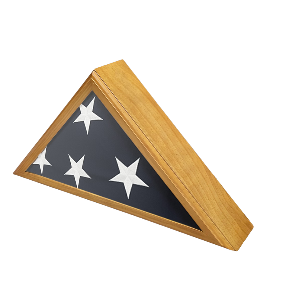 A triangular flag display case with a wooden frame on a white background featuring.  The flag is folded showing four white stars and the blue canton