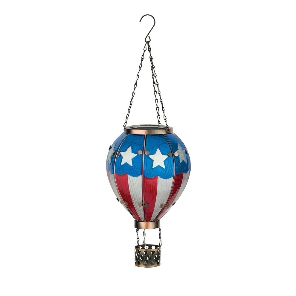 A decorative lantern shaped like a hot air ballon with an American Flag design