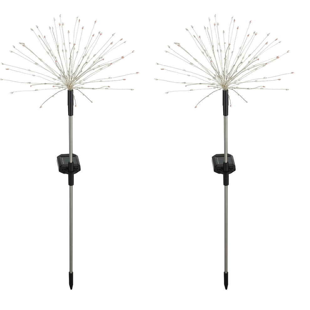 Two solar garden lights with starburst design on white background