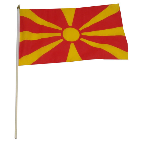 Macedonian flag with red background and yellow sunburst pattern