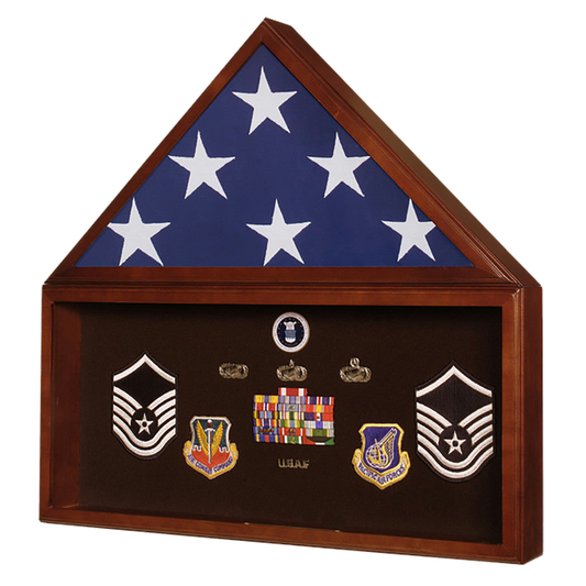 Wooden display case with military insignias and flags on a white background
