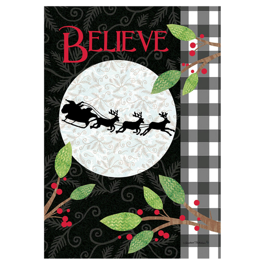 Decorative flag with 'BELIEVE' text, Santa Claus sleigh, and Christmas elements on a black background.