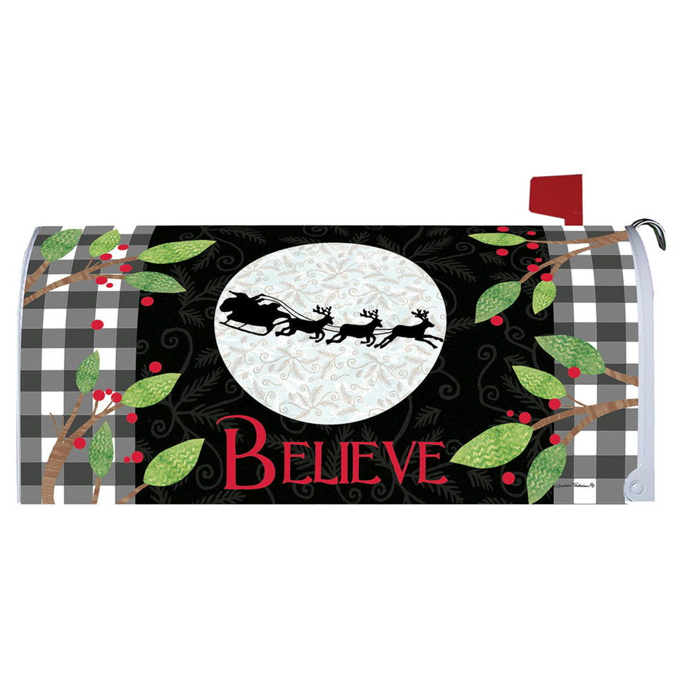 Christmas-themed mailbox cover with reindeer, moon, and 'BELIEVE' text on a checkered background.
