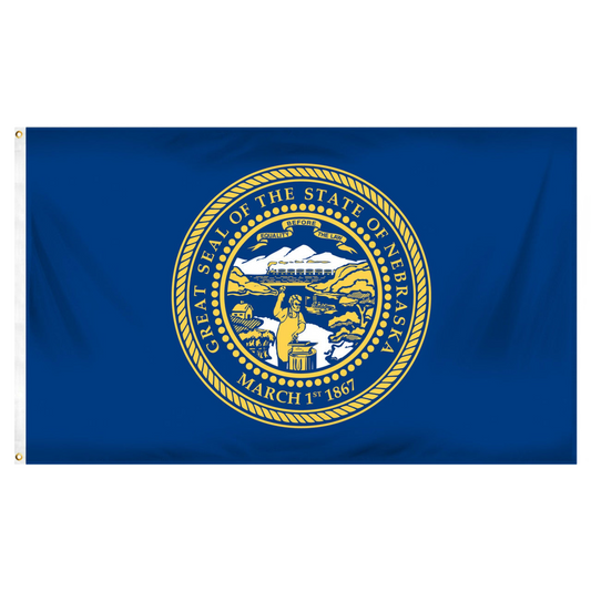 State of Nebraska state flag featuring the gold and silver state seal with the motto 'Equality Before the Law' on a solid dark blue field.  Seal includes a steamboat on a river, a train moving across mountains, a blacksmith at work, and a settler's cabin.
