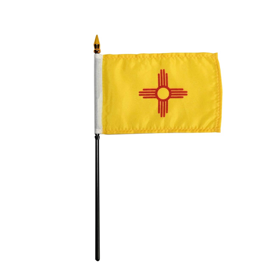 Yellow state of New Mexico stick flag with red star design on a white background
