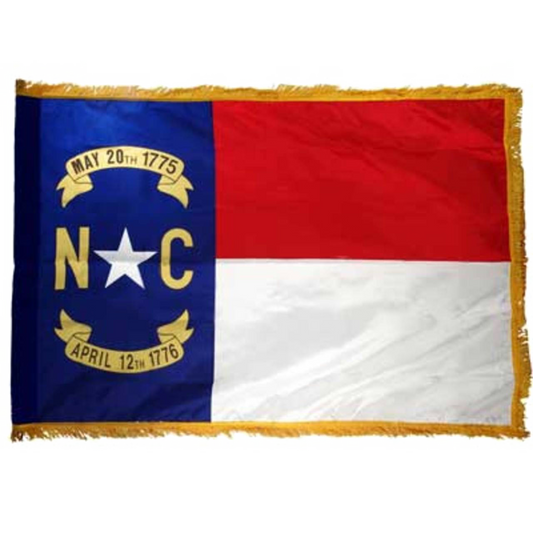 North Carolina state flag with blue, red, and white sections featuring text and symbols