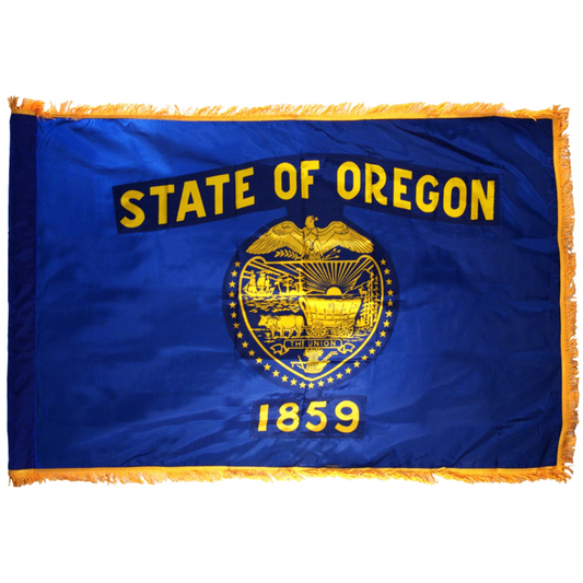 Flag of the State of Oregon with blue background and yellow text and emblem.  Flag features fringe.