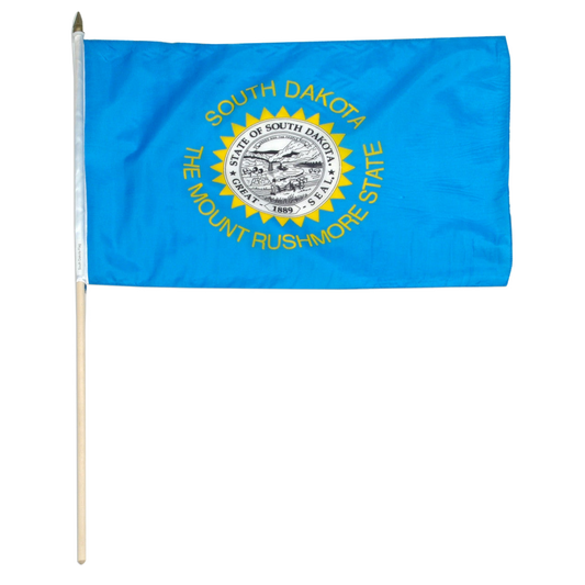 State of South Dakota state stick flag featuring the full-color state seal, gold sunburst, and 'South Dakota, The Mount Rushmore State' text on a solid sky-blue field