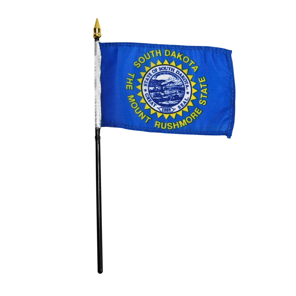 State of South Dakota state stick flag featuring the full-color state seal, gold sunburst, and 'South Dakota, The Mount Rushmore State' text on a solid sky-blue field