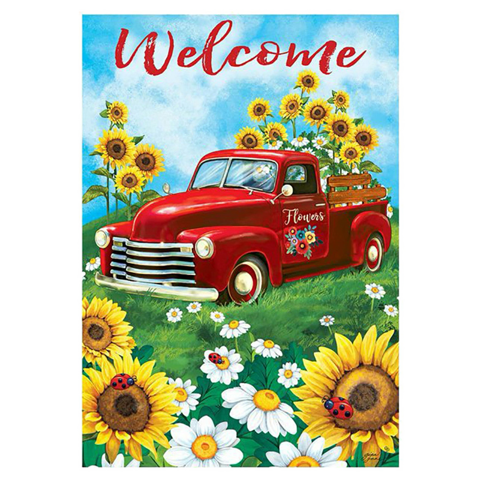 Decorative flag with a red truck with sunflowers and flowers in a field, featuring the word 'Welcome'.