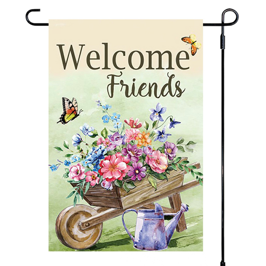 Garden flag with 'Welcome Friends' text, flowers, wheelbarrow, and watering can on a light green background.