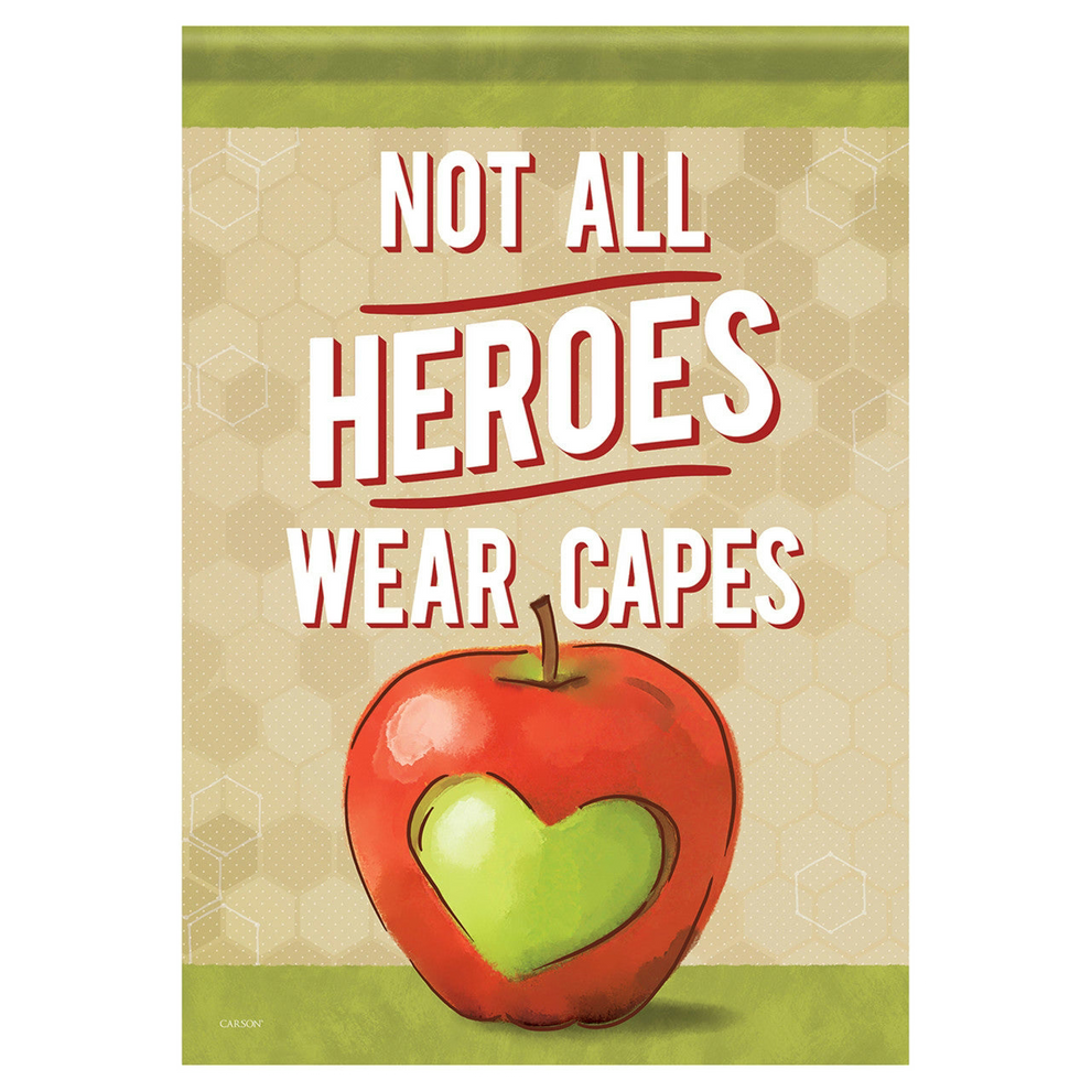 Decorative garden flag with a red apple with a green heart and text 'Not All Heroes Wear Capes' on a beige background.