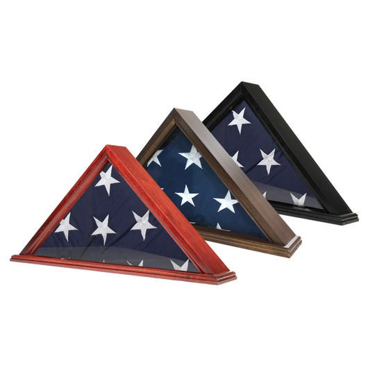 Three triangular folded flag display cases shown on a white background, each holding a folded U.S.