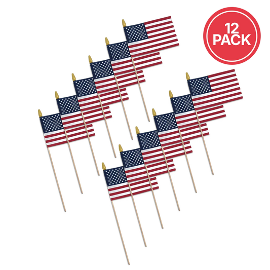 Twelve miniature American flags on wooden picks, arranged in two rows, with a red circular badge in the top right corner that reads '12 PACK'.