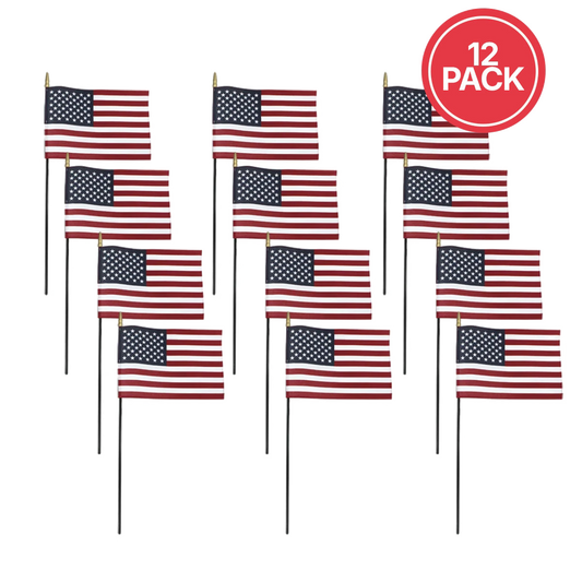 Twelve small American flags on thin black sticks arranged in a grid on a white background, with a red circular badge in the top right that says "12 PACK.".