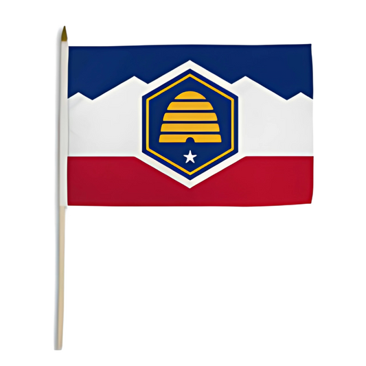 Small Utah state flag with a blue, white, and red design featuring a central emblem on a white background