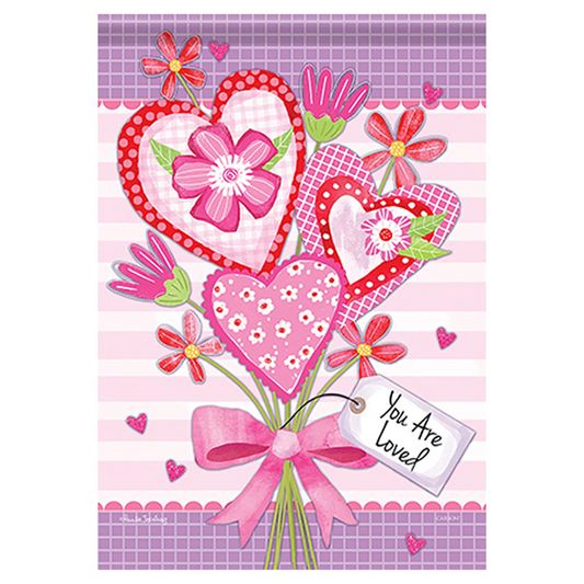 Decorative flag with hearts, flowers, and a pink bow on a checkered background