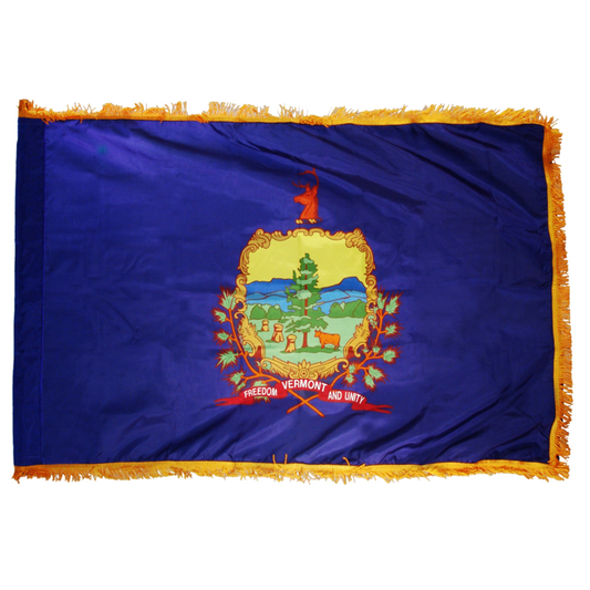 Vermont state flag featuring the full-color state coat of arms and 'Vermont, Freedom and Unity' motto on a solid azure blue field.  Flag has fringes.