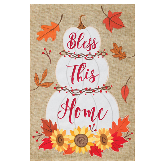 Decorative banner with 'Bless This Home' text, pumpkins, and autumn leaves on a burlap background.