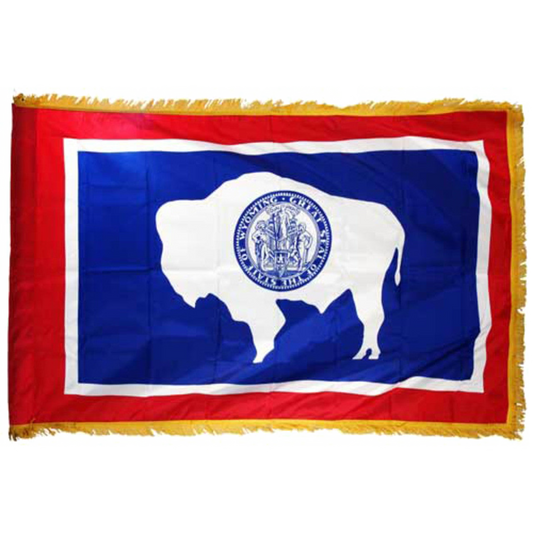 Wyoming state flag with a white silhouette of a bison and a blue background on a red field, featuring a yellow fringe border.