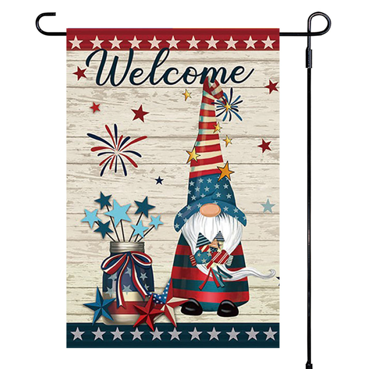 Decorative garden flag with a gnome, stars, and fireworks design on a wooden background.