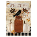 Decorative fall-themed flag with a mason jar, pumpkins, and a crow on a wooden background.