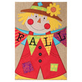Decorative sign with a scarecrow design and 'Fall' banner on a burlap background