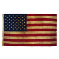 Vintage American flag with visible wear on a white background
