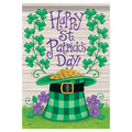 St. Patrick's Day decorative flag with green hat, gold coins, and shamrocks on a wooden background.