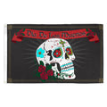 Flag with a colorful skull design and 'Dia De Los Muertos' text on a black background