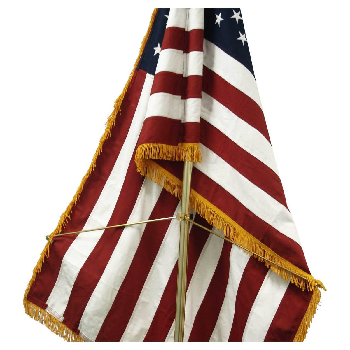 American flag with gold fringe on a white background