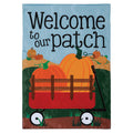 Decorative garden flag with pumpkins and a wagon, featuring the text 'Welcome to our patch'.