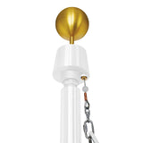 Commercial grade flagpole with a gold-colored ball on top, equipped with a wire cable system.