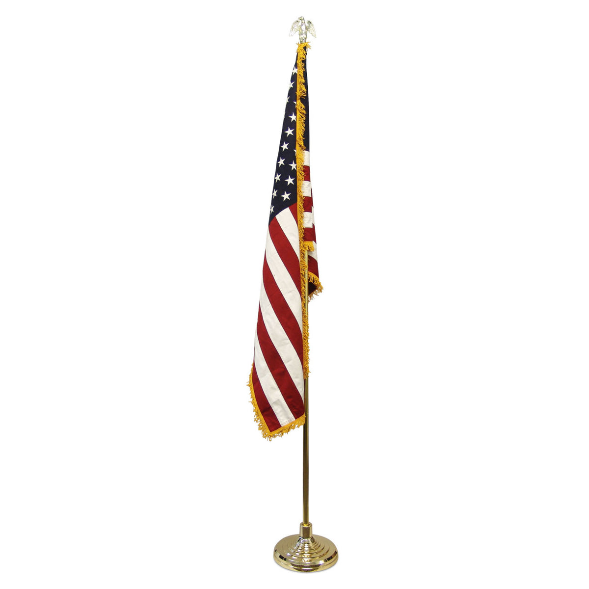 Indoor American flag with gold fringe on a gold pole with an eagle finial and base.