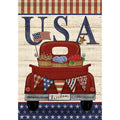 Decorative flag with a red truck, American flags, and 'USA' text on a wooden background.