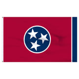 A Tennessee state flag shown flat against a white background, with a red field, a blue circle containing three white stars, and a narrow blue stripe along the hoist side.
