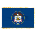 Flag of Utah with a blue background and emblem featuring an eagle and American flags.