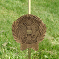Bronze Persian Gulf War memorial grave marker on a grassy background